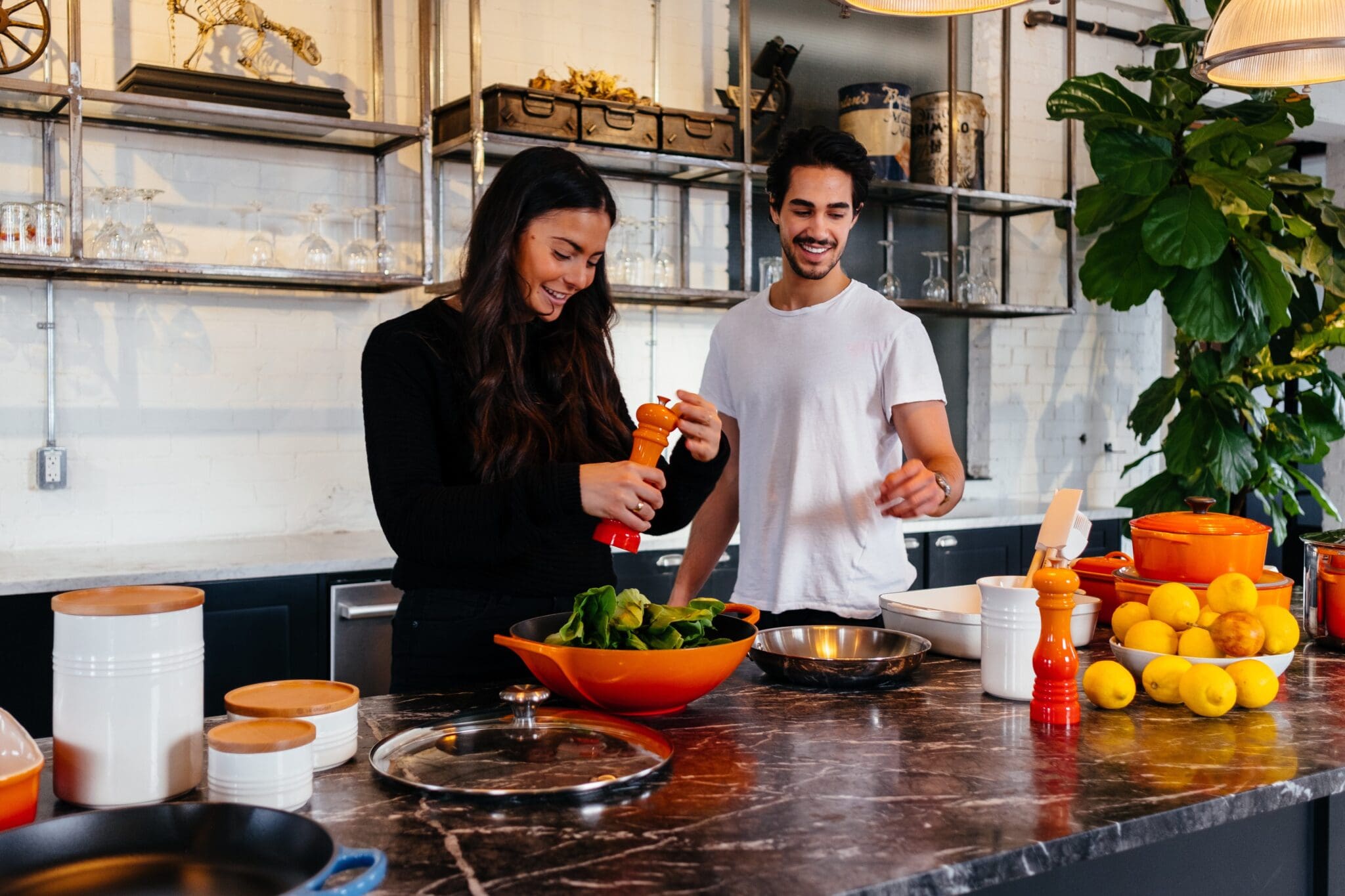 Students preparing food together in a shared kitchen