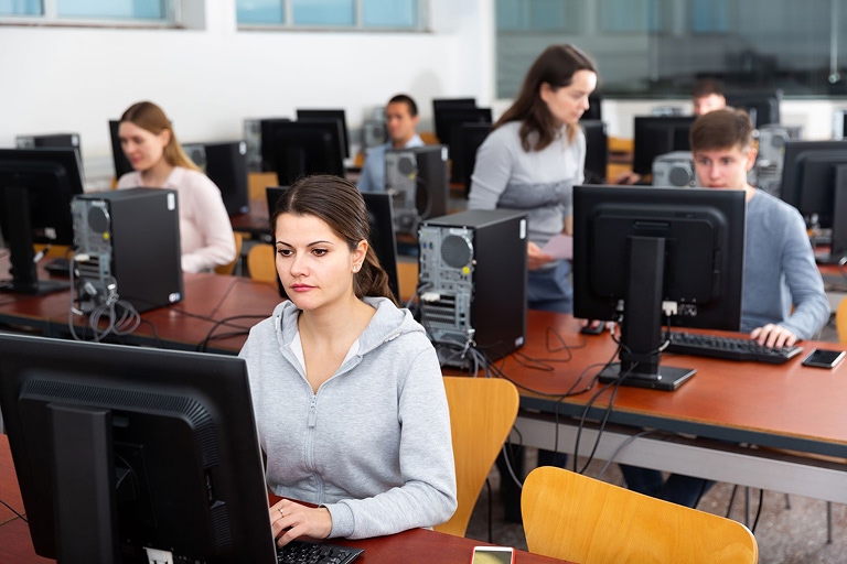 A woman at a computer taking a test