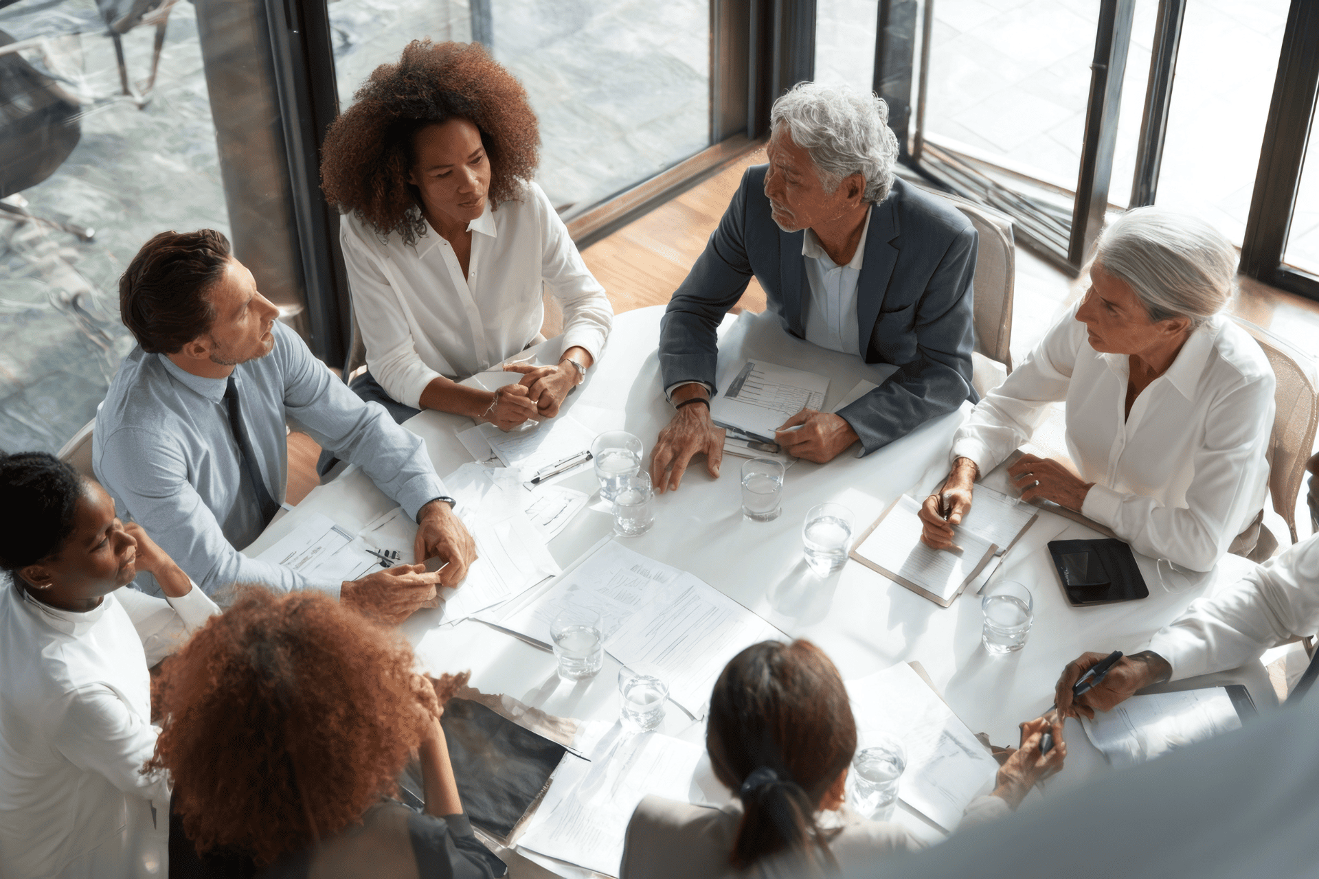 Professionals sitting around a table having a meeting