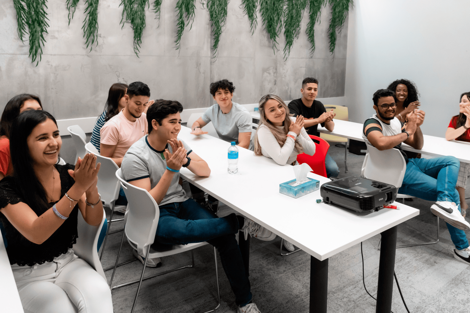 ILAC students clapping inside classroom