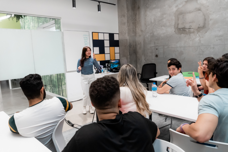 ILAC students discussing English with the teacher in class
