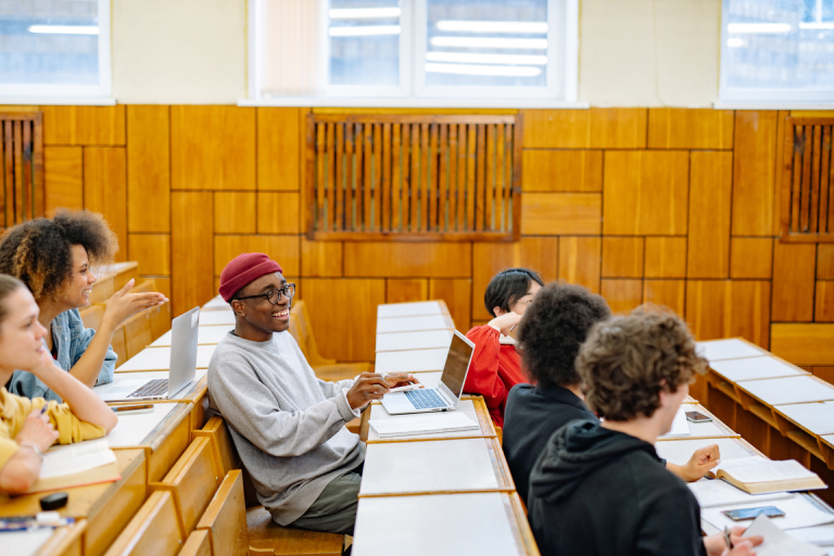 International students sitting and talking with each other in a classroom